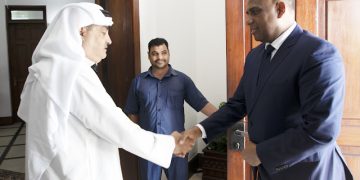 BALOZI MBAROUK ASAINI KITABU CHA MAOMBOLEZO UBALOZI WA KUWAIT DAR ES SALAAM